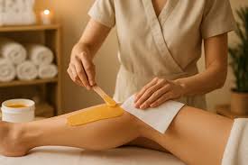 Wax being applied during a leg waxing session.