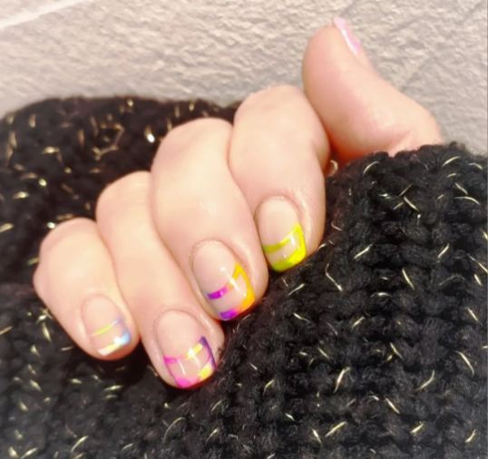 Nails with intricate gel art design
